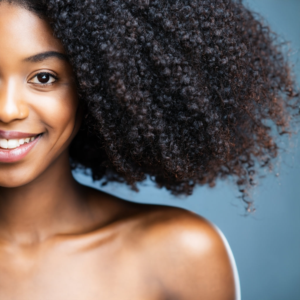 Beautiful African American woman with lots of hair smiling
