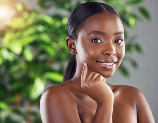 Beautiful black woman with tree in back ground