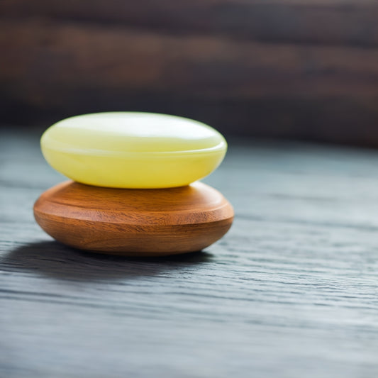 two bars of natural soap on a surface