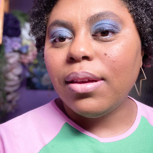 black woman with Strawberry Skin on face -keratosis pilaris