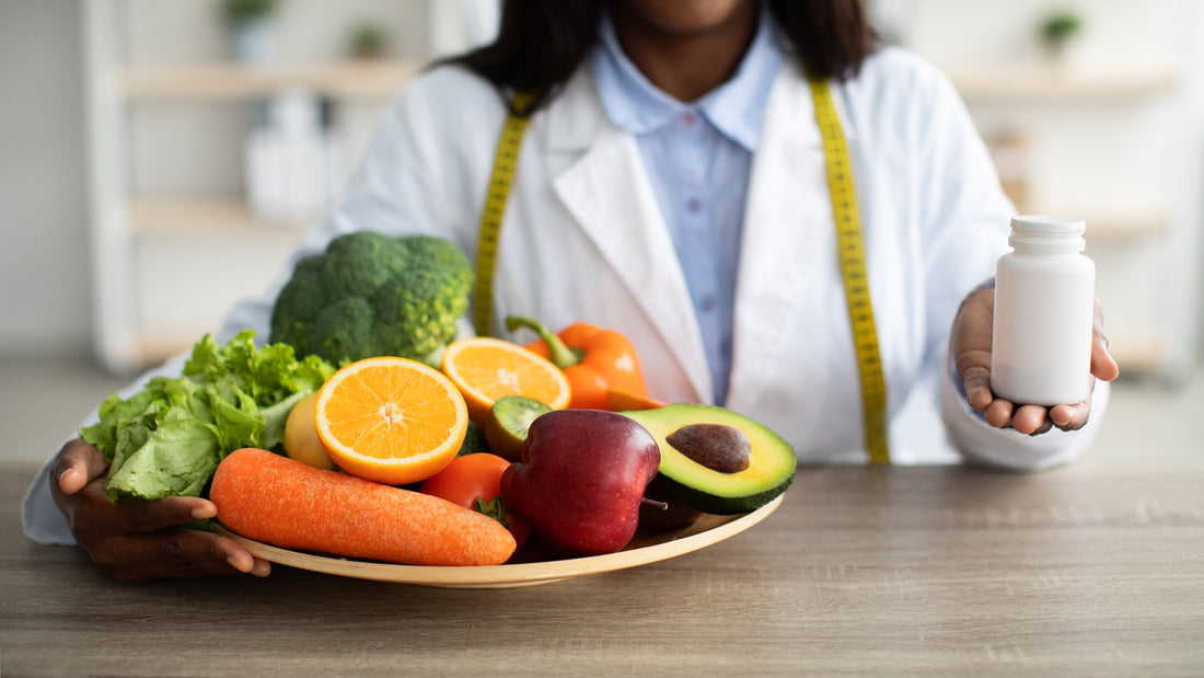 A woman in a lab coat holds a plate of fruits and vegetables. Image: 'A Look At Multivitamins for Men and Women'.