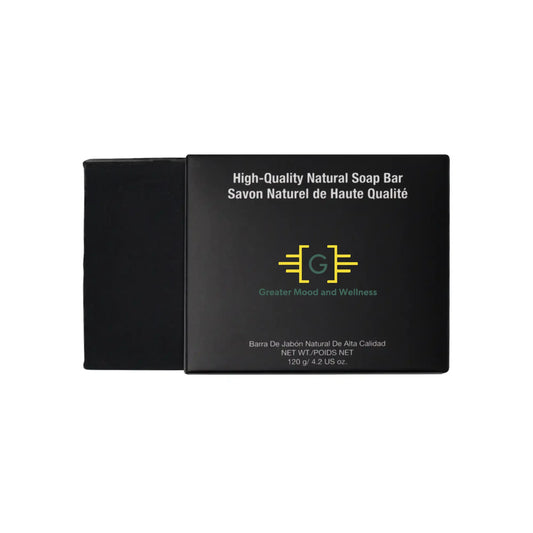 Black box with 'high quality natural soap bar' on cover, next to charcoal soap.