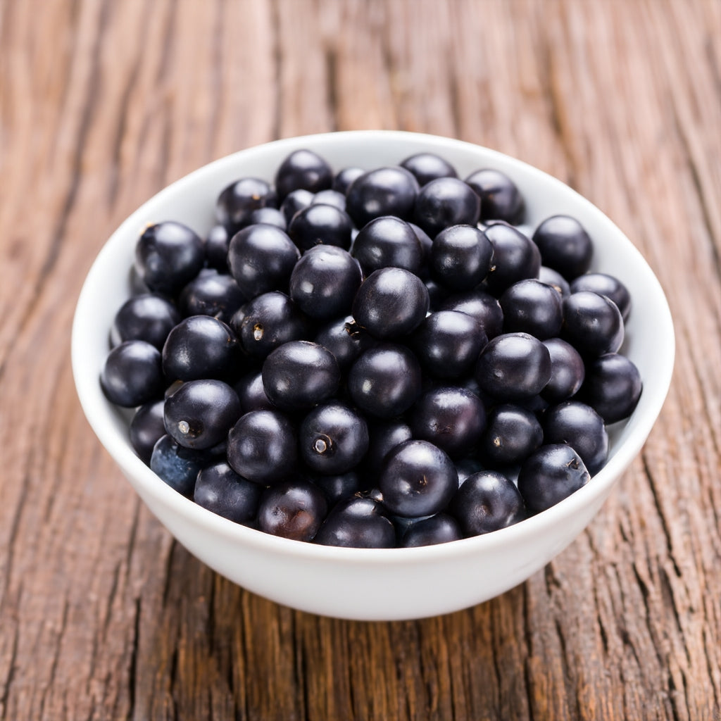 White bowl with Acai berry on a wooden table top