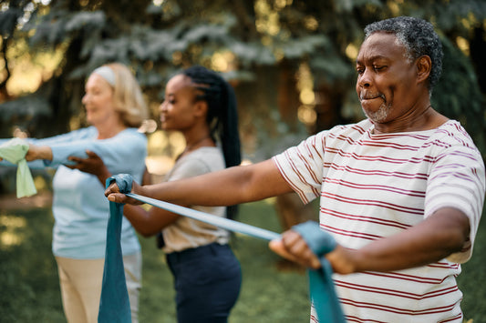 Senior individuals using resistance bands for exercise.