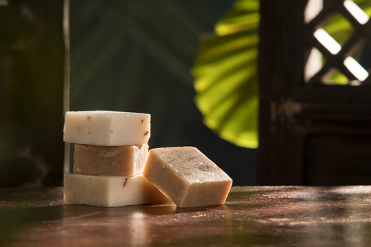 Close up view of few pieces of turmeric soap on natural background
