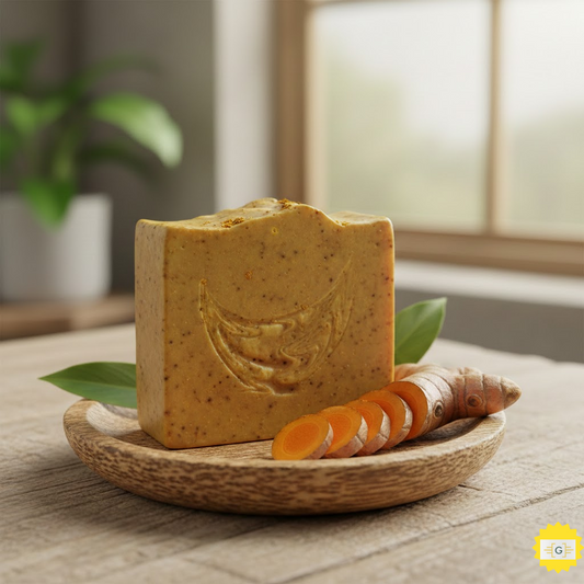 Handmade turmeric soap bar on a wooden dish with fresh turmeric root slices