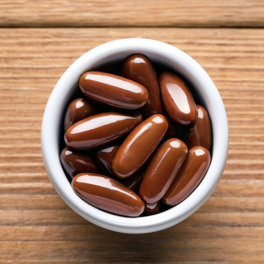 container on wooden surface with Pygeum africanum,