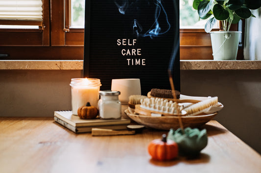 A wooden table with a sign that reads 'self care time