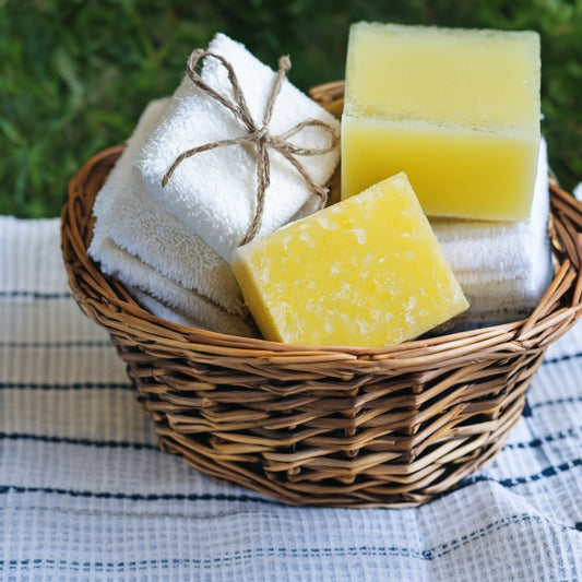 Organic Bath Soap Bars in basket on towel 