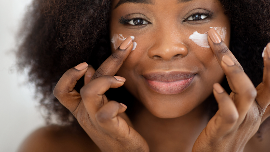 woman applying eye cream