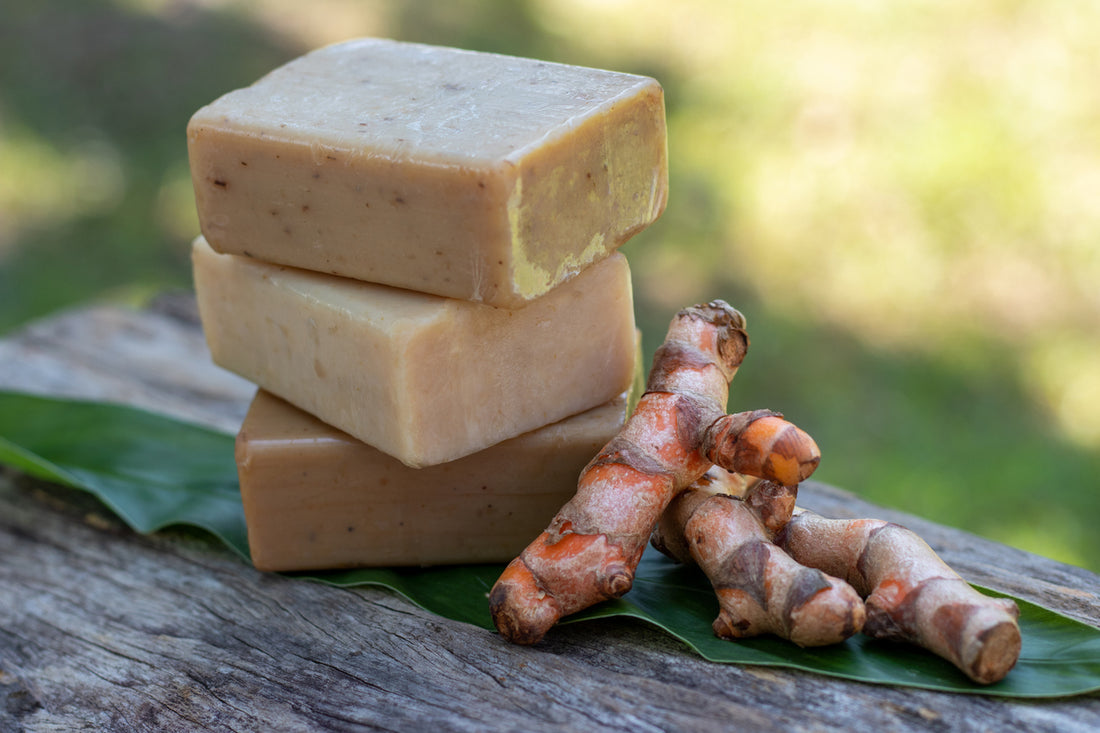 Turmeric,bar soap on wooden background. 