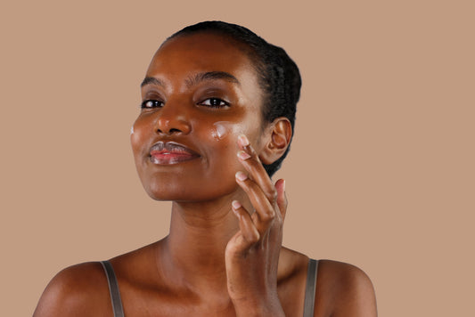 Young beautiful african american woman skincare and beauty routine, applying lotion, moisturizer