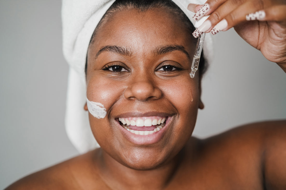 African young woman applying hyaluronic acid and skin mask beauty treatment on her face