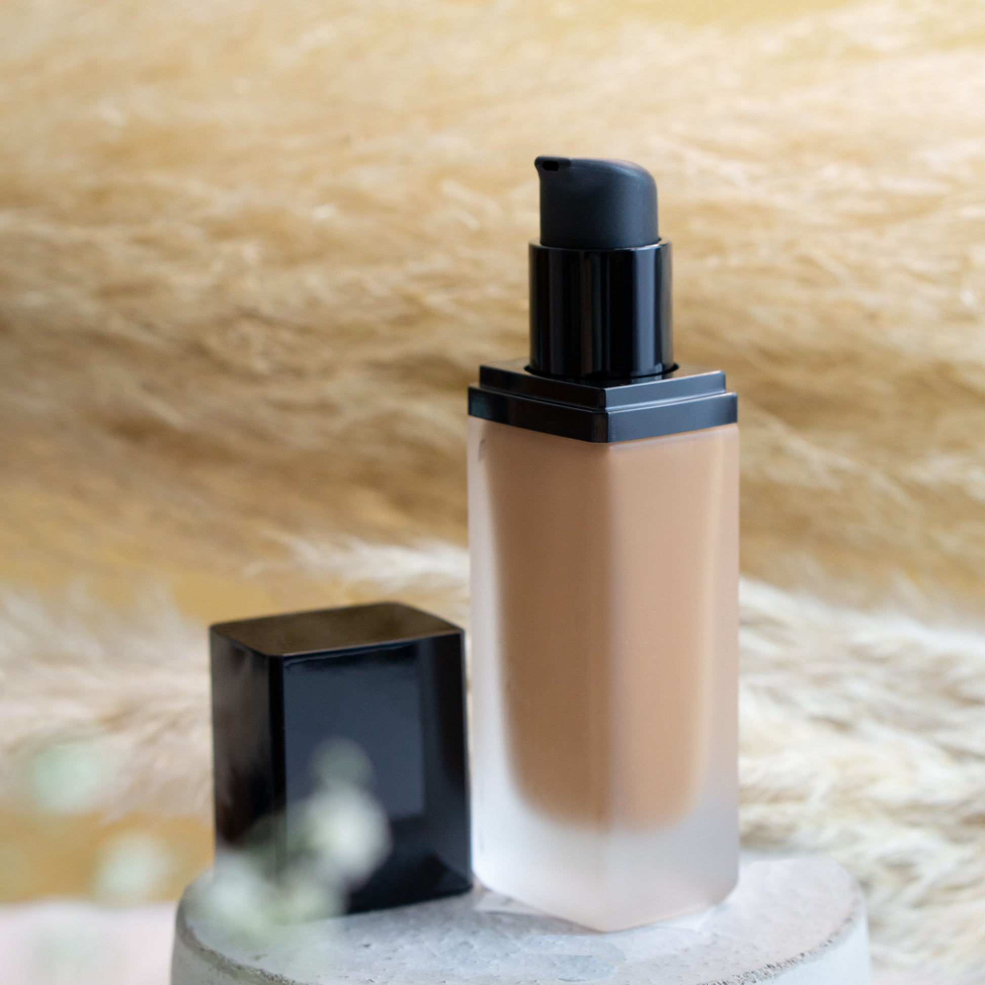 2. Foundation With Spf bottle against a white backdrop.