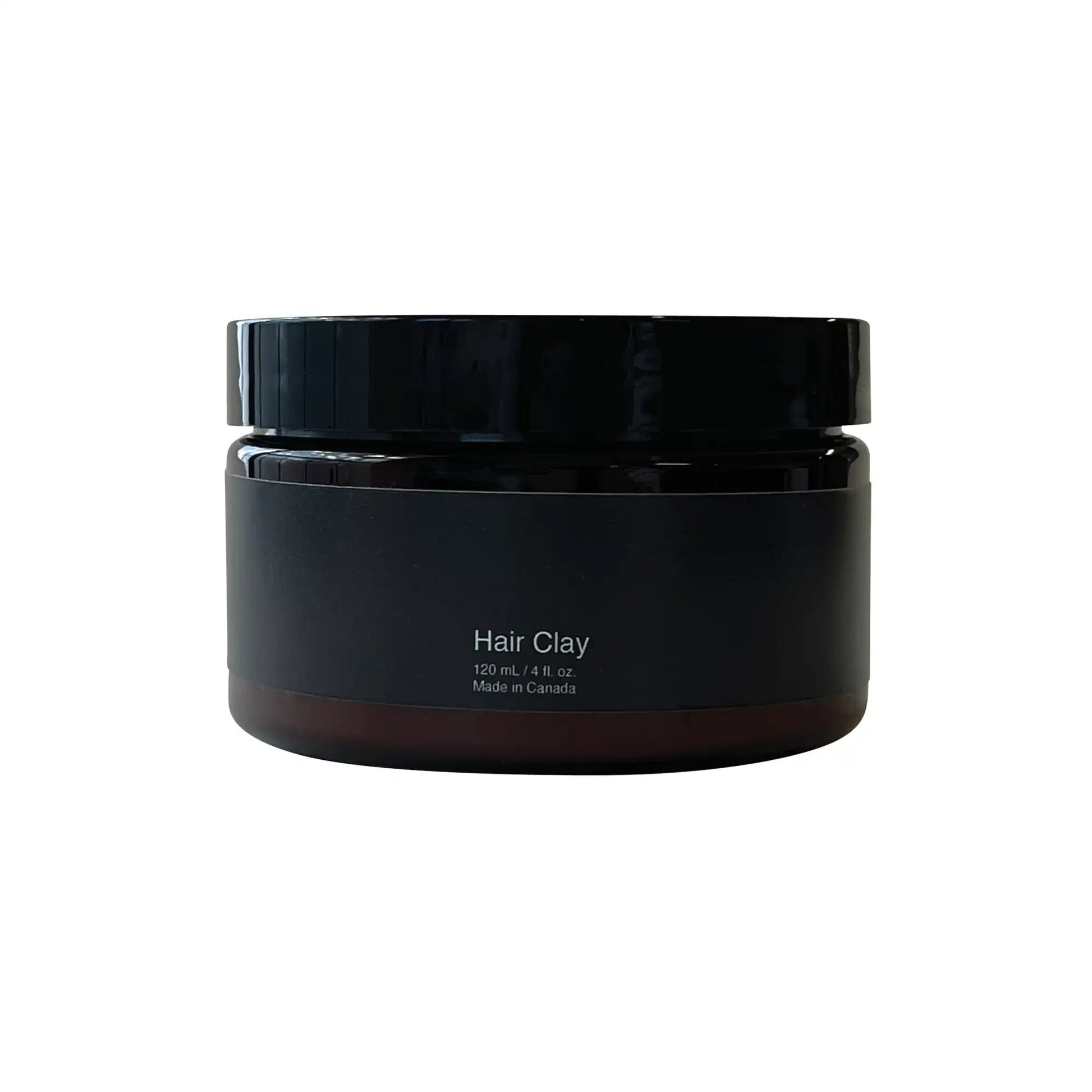 Hair Clay For Men in black powder container with black lid.